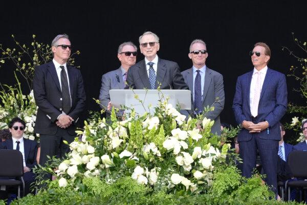 With his four sons behind him, Irwin Jacobs remembers his wife at the Rady Shell in Jacobs Park on May 13, 2024. (Jie Yang/The Epoch Times)