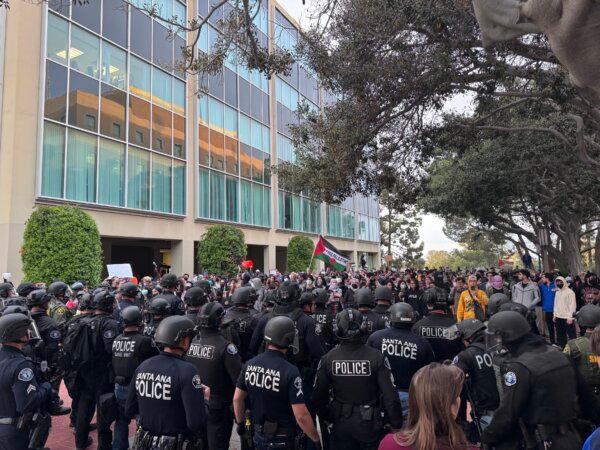 Police move to break up a pro-Palestinian protest at the University of California–Irvine on May 15, 2024. (Rudy Blalock/The Epoch Times)