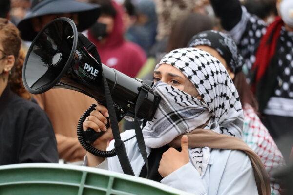 Pro-Palestinian students speak during a protest at the University of California–Irvine in Irvine, Calif., on May 15, 2024. (May He/The Epoch Times)