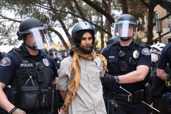 Law enforcement officers arrest a person during a pro-Palestinian protest at the University of California–Irvine in Irvine, Calif., on May 15, 2024. (May He/The Epoch Times)
