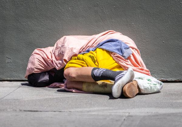 A homeless individual in the Tenderloin District of San Francisco on May 16, 2024. (John Fredricks/The Epoch Times)