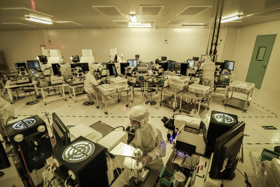 Employees make chips at a semiconductor factory in Nantong, in eastern China's Jiangsu Province, on March 17, 2021. (STR/AFP via Getty Images)