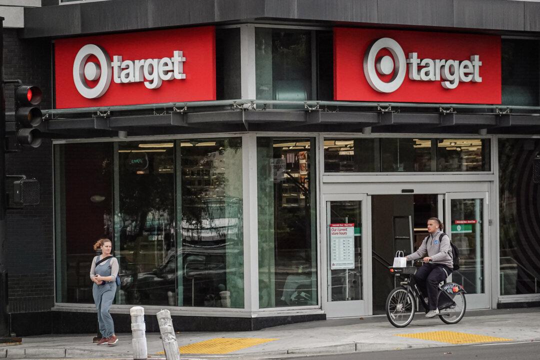 A cyclist rides by a Target store that is slated for closure in Oakland, Calif., on Sept. 29, 2023. (Justin Sullivan/Getty Images)