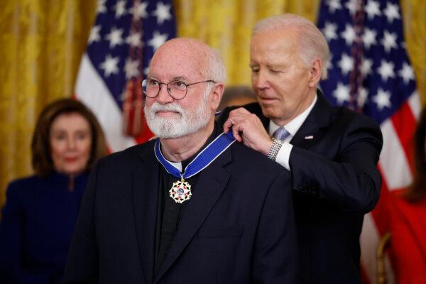 U.S. President Joe Biden awards the Medal of Freedom to Jesuit Catholic priest Fr. Greg Boyle during a ceremony in the East Room of the White House in Washington, DC., on May 3, 2024. (Kevin Dietsch/Getty Images)