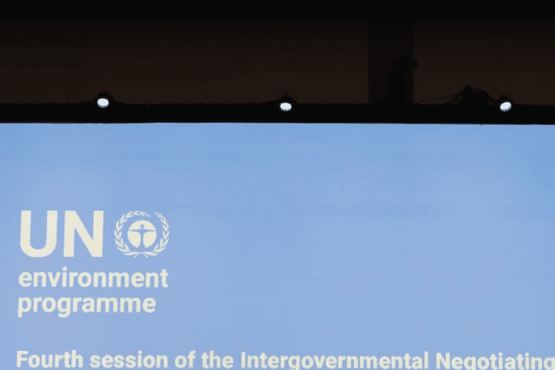 (Left) The secretariat of the Intergovernmental Negotiating Committee (INC) to Develop an International Legally Binding Instrument on Plastic Pollution consults on the dais during the closing plenary in Ottawa on April 30, 2024; (Center) Members of Greenpeace holds up placards during the discussions in Ottawa, Canada, on April 23, 2024.; (Right) Pro-plastic messaging was seen at hotels in Ottawa during the UN INC meetings. (IISD-ENB/Kiara Worth, DAVE CHAN/AFP via Getty Images)