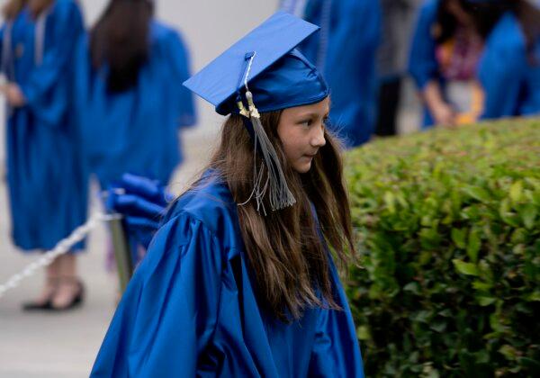 Athena Elling walks towards the stage duing the Irvine Valley College Commencement in Irvine, Calif., on May 23, 2024. (Sophie Li/The Epoch Times)