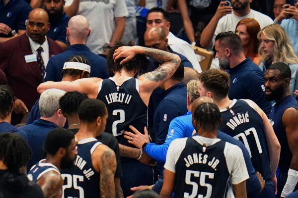 Mavericks center Dereck Lively II is helped off the court after suffering a head injury during Game 3 of the NBA Western Conference finals against the Timberwolves in Dallas on May 26, 2024. (Gareth Patterson/AP Photo)