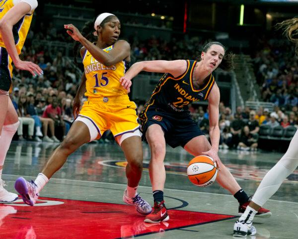 Caitlin Clark of the Fever drives against the Sparks' Aari McDonald in Indianapolis on May 28, 2024. (Michael Conroy/AP Photo)