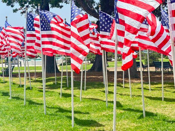 Police say they received a report about the upside-down flags, once a signal of distress for sailors, Friday morning from the city’s public works department. (Jill McLaughlin/The Epoch Times)