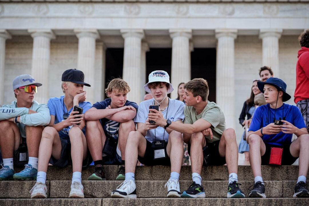 A tourist wears a Trump hat near the Lincoln Memorial after former President Donald Trump was found guilty in New York, in Washington on May 30, 2024. (Andrew Harnik/Getty Images)