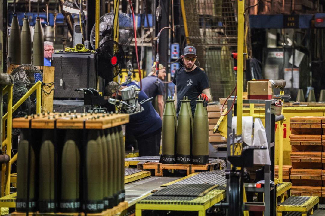 A worker prepares 155 mm caliber shells for shipment at the Scranton Army Ammunition Plant in Scranton, Pa., on April 16, 2024. (Charly Triballeau/AFP via Getty Images)