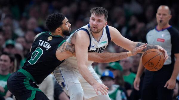 Stars Jayson Tatum (L) of the Celtics and Luka Doncic of the Mavericks go head-to-head during Game 2 of the NBA Finals in Boston on June 9, 2024. (Steven Senne/AP Photo)