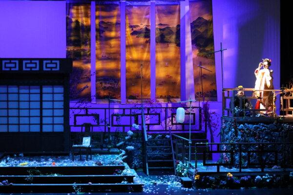 Cio-cio-san watches for Pinkerton’s ship through her looking glass in Pacific Opera Project's production of "Madama Butterfly" (Courtesy of Pacific Opera Project)