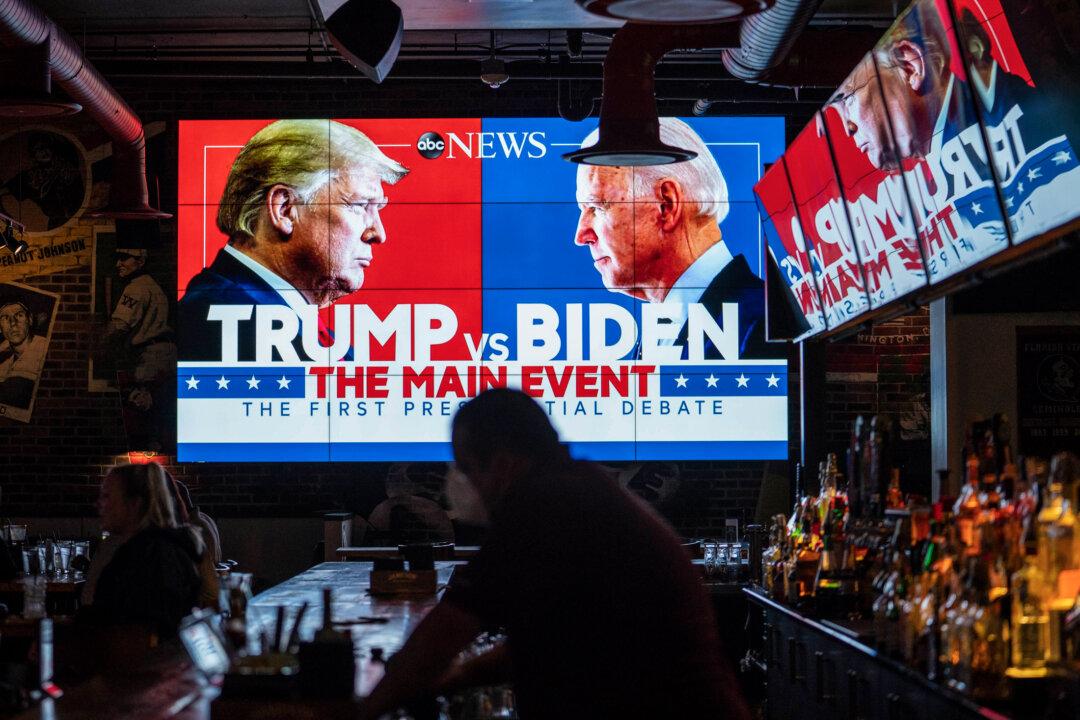 The first presidential debate between candidates Donald Trump and Joe Biden during the 2020 election is broacasted at Walters Sports Bar in Washington on Sept. 29, 2020. (Sarah Silbiger/Getty Images)