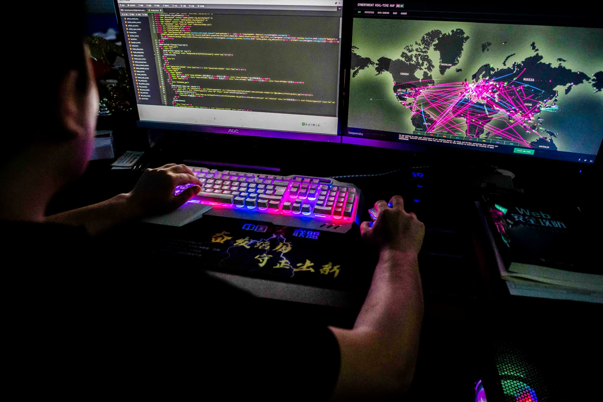 Prince, a member of the hacking group Red Hacker Alliance who refused to give his real name, uses a website that monitors global cyberattacks on his computer at their office in Dongguan, Guangdong Province, China, on Aug. 4, 2020. (Nicolas Asfouri/AFP via Getty Images)