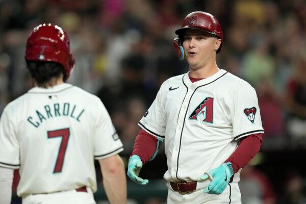 The Diamondbacks' Joc Pederson (R) celebrates his grand slam against the Angels with teammate Corbin Carroll in Phoenix on June 13, 2024. (Ross D. Franklin/AP Photo)