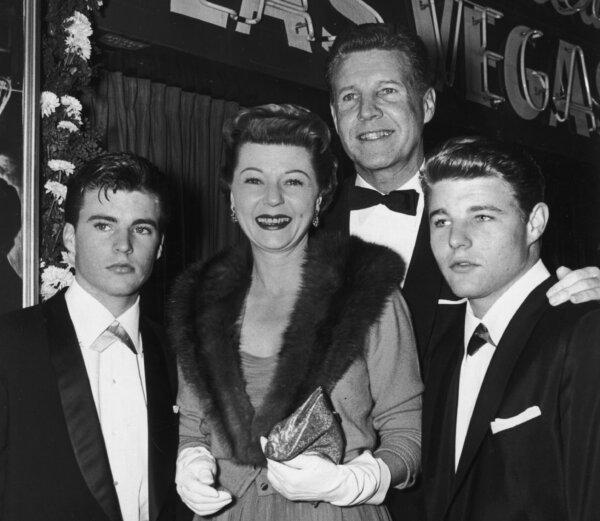 Married American actors Ozzie and Harriet Nelson smile with their sons Rick (L) and David as they attend the premiere of director Mark Robson's film, "Peyton Place" in 1957. (Jack Albin/Hulton Archive/Getty Images)