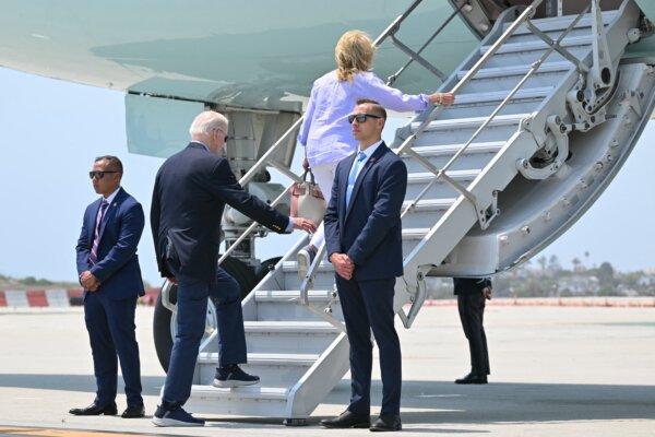 President Joe Biden and First Lady Jill Biden board Air Force One at Los Angeles International Airport on June 16, 2024.  More than one-third of likely voters said they were "very interested" in the presidential debates. (Mandel Ngan / AFP)