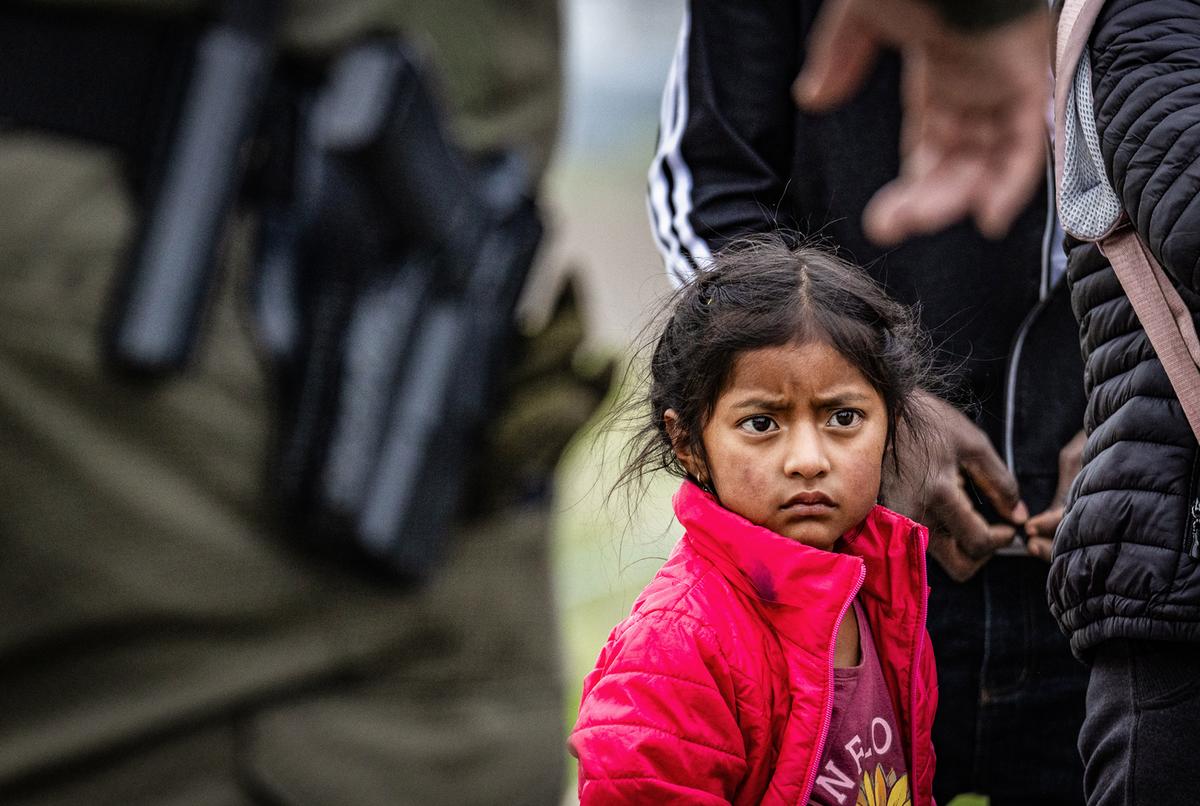 Unaccompanied minors aged 3 to 9 sit inside a playpen at the Donna Department of Homeland Security holding facility in Donna, Texas, on March 30, 2021. (Dario Lopez-Mills/AFP via Getty Images)