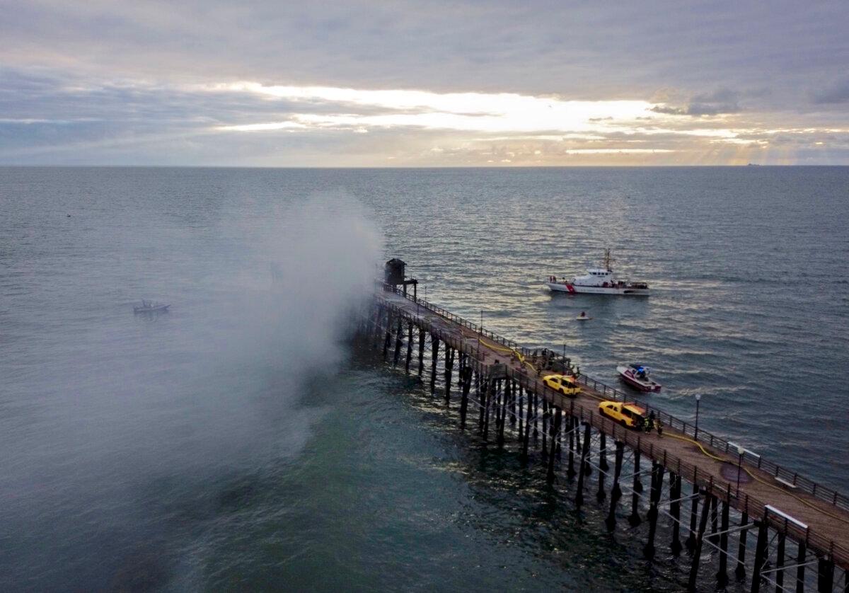 A fire burns on the West end of the Oceanside Pier, in Oceanside, Calif., on April 25, 2024. (Sandy Huffaker/AFP via Getty Images)