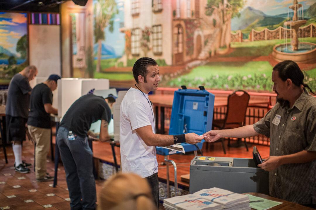 Latinos vote at a polling station in El Gallo Restaurant in Los Angeles on Nov. 8, 2016. Latinos will make up 13 percent of eligible voters in the 2024 election, according to the Pew Research Center. (David McNew/Getty Images)