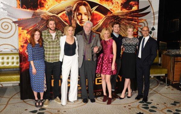 Julianne Moore, Liam Hemsworth, Jennifer Lawrence, Donald Sutherland, Elizabeth Banks, Sam Claflin, Natalie Dormer, and Stanley Tucci pose for pictures for an event for The Hunger Games: Mockingjay Part in London in a file photograph. (Stuart C. Wilson/Getty Images)