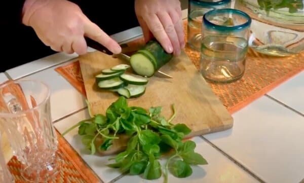Kami McBride preparing cucumber and mint for her water. (Courtesy of Kami McBride)
