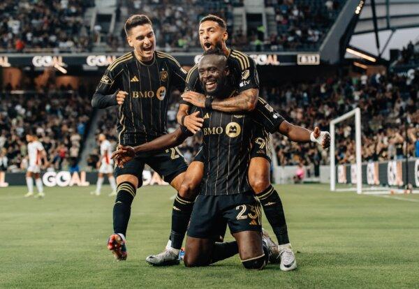 LAFC forward Kei Kamara (23) celebrates his 146th league goal, second all-time, with teammates Denis Bouanga (99) and Tomas Angel (L) in a soccer match against the San Jose Earthquakes in Los Angeles on June 22, 2024. (Courtesy of LAFC via The Epoch Times)