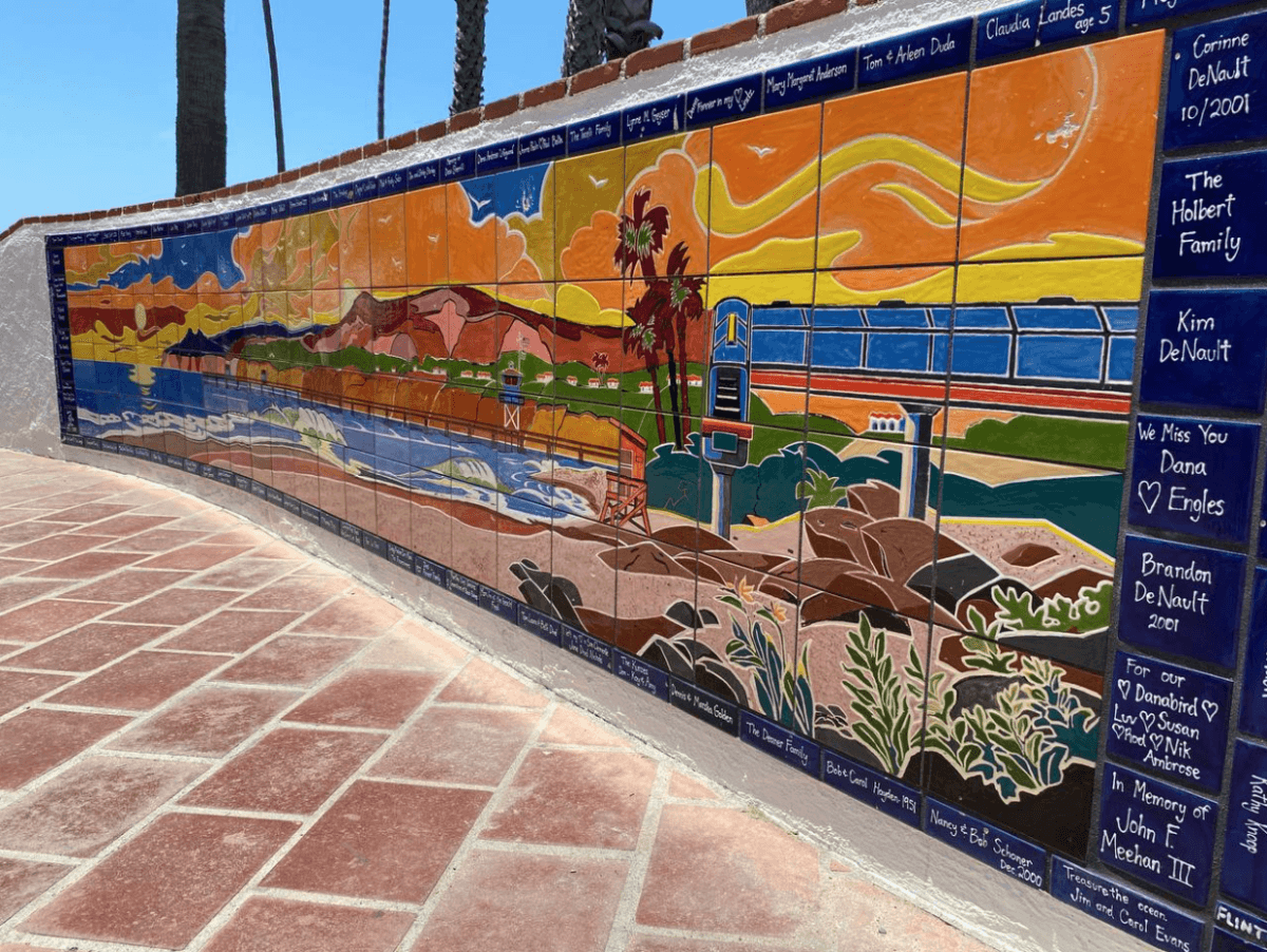 A colorful mosaic at the entrance to San Clemente state beach, where trains whip by the short pier, in San Clemente, Calif., on May 29, 2024. (Kimberly Hayek/The Epoch Times)