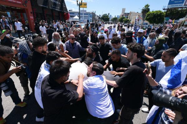 Supporters of Israel clash with pro-Palestinian protesters blocking access to the Adas Torah Orthodox Jewish synagogue, in Los Angeles on June 23, 2024. (David Swanson/AFP via Getty Images)