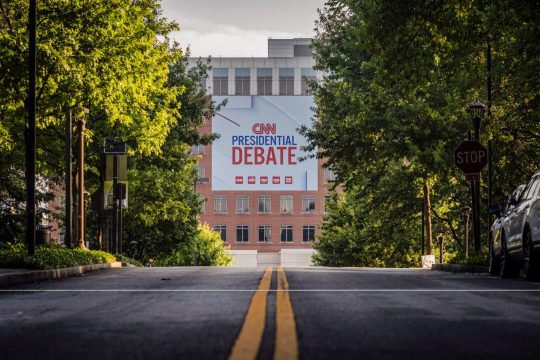 A banner is hung outside the CNN studios ahead of the first presidential debate, in Atlanta, on June 24, 2024. (Christian Monterrosa/AFP via Getty Images)