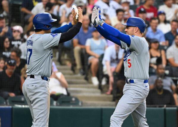 Freddie Freeman (5) of the Los Angeles Dodgers is congratulated by Shohei Ohtani (17) of the Los Angeles Dodgers after his third inning two-run home run against the Chicago White Sox in Chicago on June 25, 2024. (Nuccio DiNuzzo/Getty Images)
