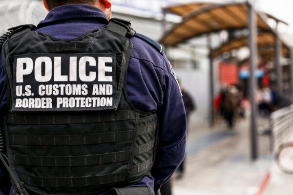 Customs and Border Protection agents check pedestrians as they exit Mexico into the customs area of the United States on Nov. 19, 2018. (Charlotte Cuthbertson/The Epoch Times)