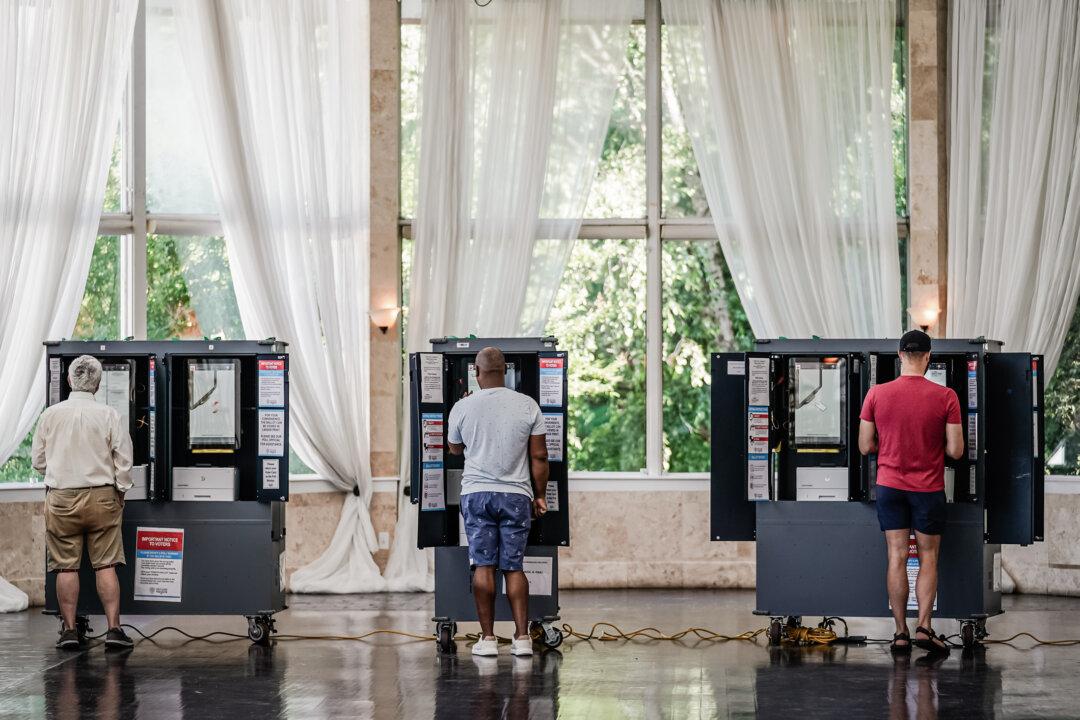 Voters cast ballots in Georgia's primary election at a polling location in Atlanta on May 21, 2024. The Supreme Court decision may affect former President Trump's case in Georgia, as some of the acts listed in the indictment overlap with the federal case. (Elijah Nouvelage/Getty Images)