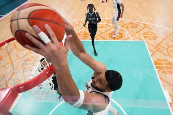 Team USA's Jayson Tatum dunks against South Sudan at the Summer Olympics in Villeneuve-d'Ascq, France, on July 31, 2024. (Mark J. Terrill/AP Photo)