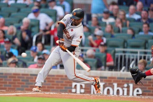 The Giants' LaMonte Wade Jr. crushes a home run against the Braves in Atlanta on July 2, 2024 (Brynn Anderson/AP Photo)