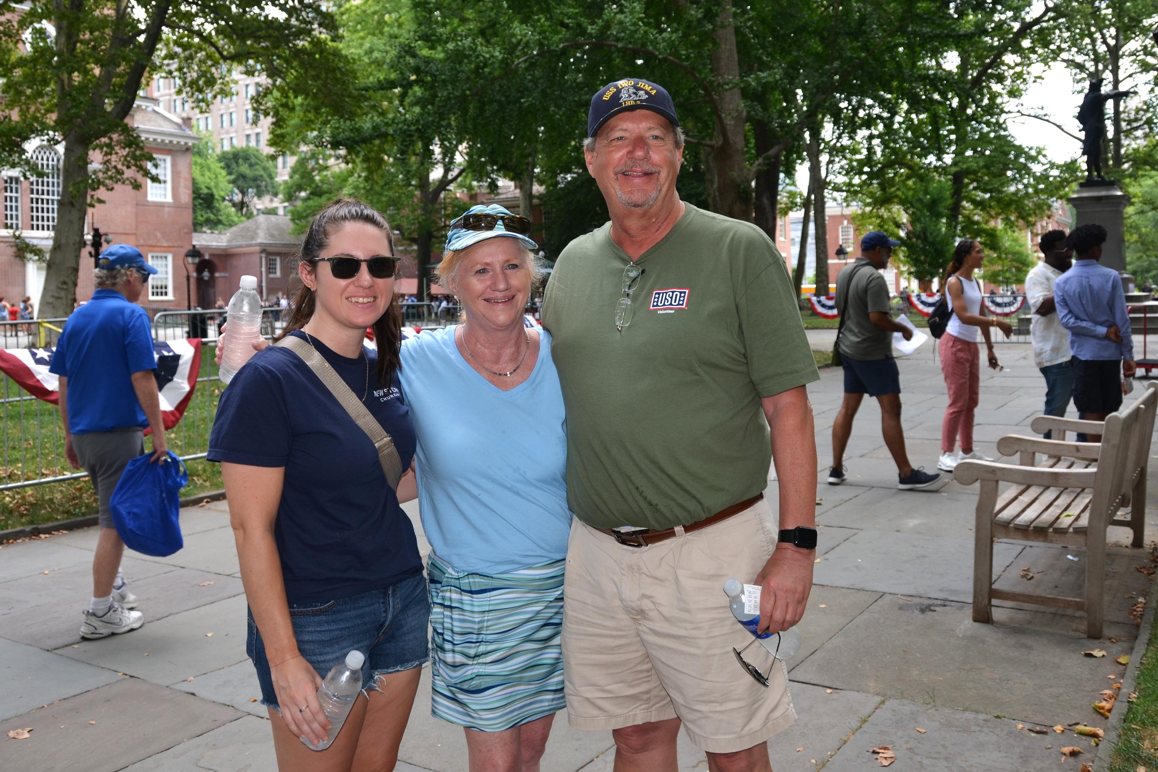 Neil Weidman (right), a retired Navy photographer from Philadelphia, attends Philadelphia’s Independence Day Parade with his wife and daughter on July 4, 2024. (Frank Liang/The Epoch Times)