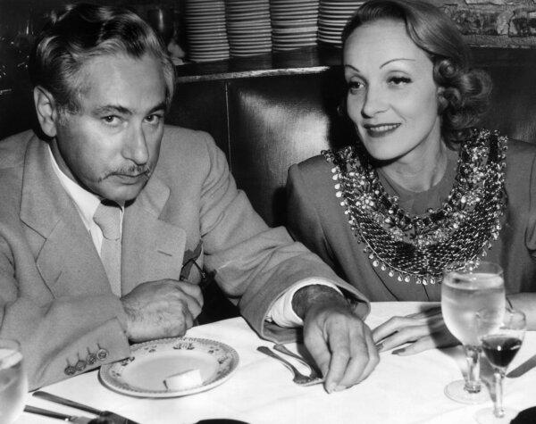 Actress Marlene Dietrich sits with film director Josef von Sternberg in a booth at the Hollywood location of Cafe La Maze, circa 1935. (Hulton Archive/Getty Images)