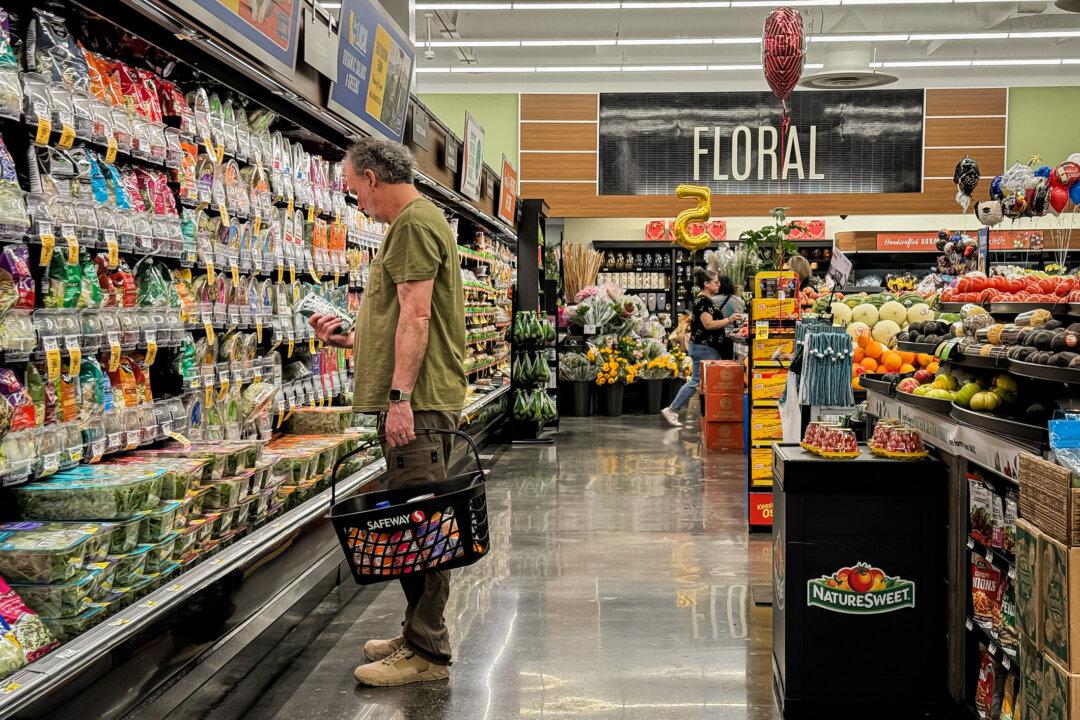 A customer shops at a grocery store in Mill Valley, Calif., on June 11, 2024. Government data show that the primary areas that demand increased spending for consumers to stay afloat are food, transportation, housing, and energy. (Justin Sullivan/Getty Images)