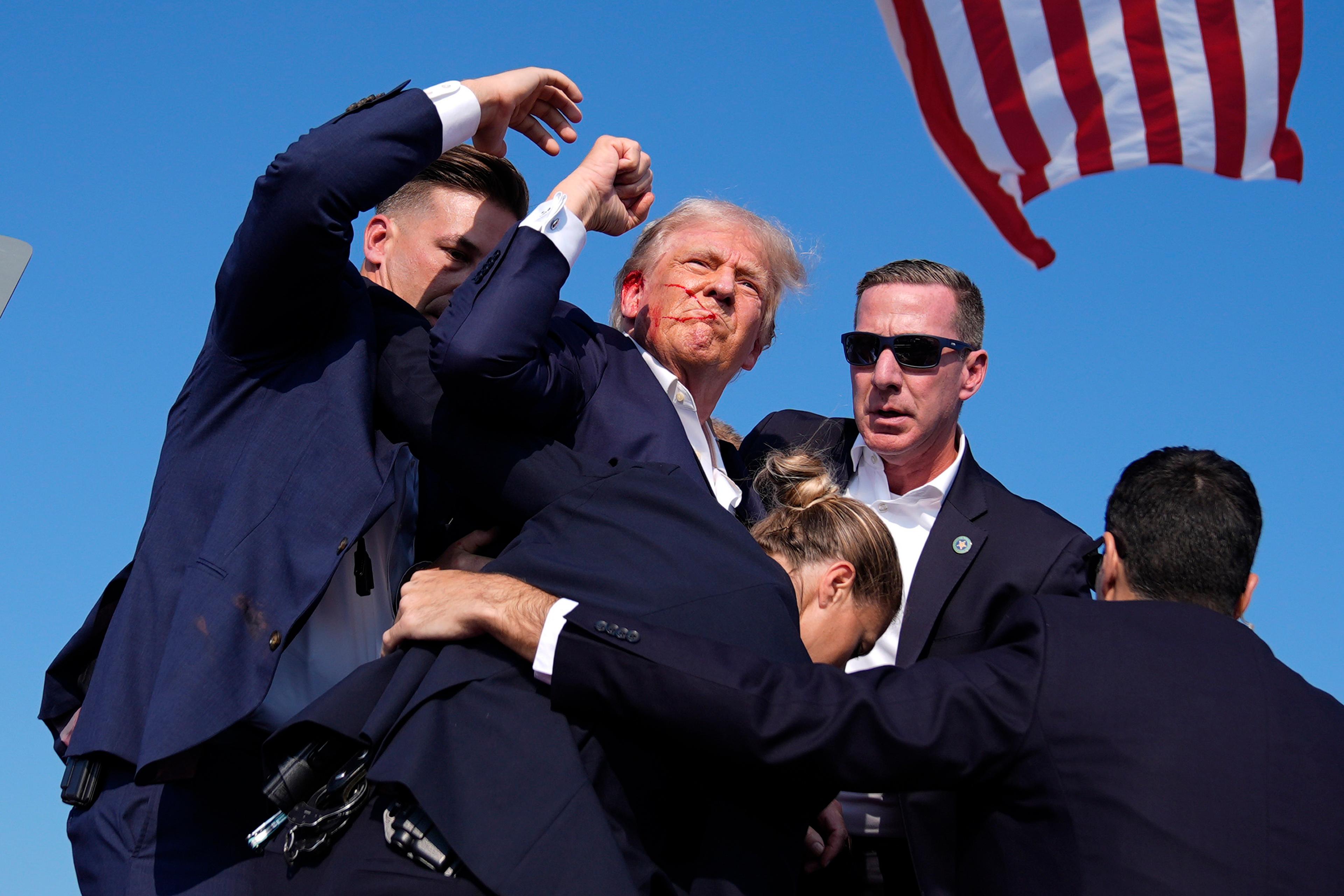 Trump Survives Assassination Attempt at Rally; Biden Urges Americans to Stand Together