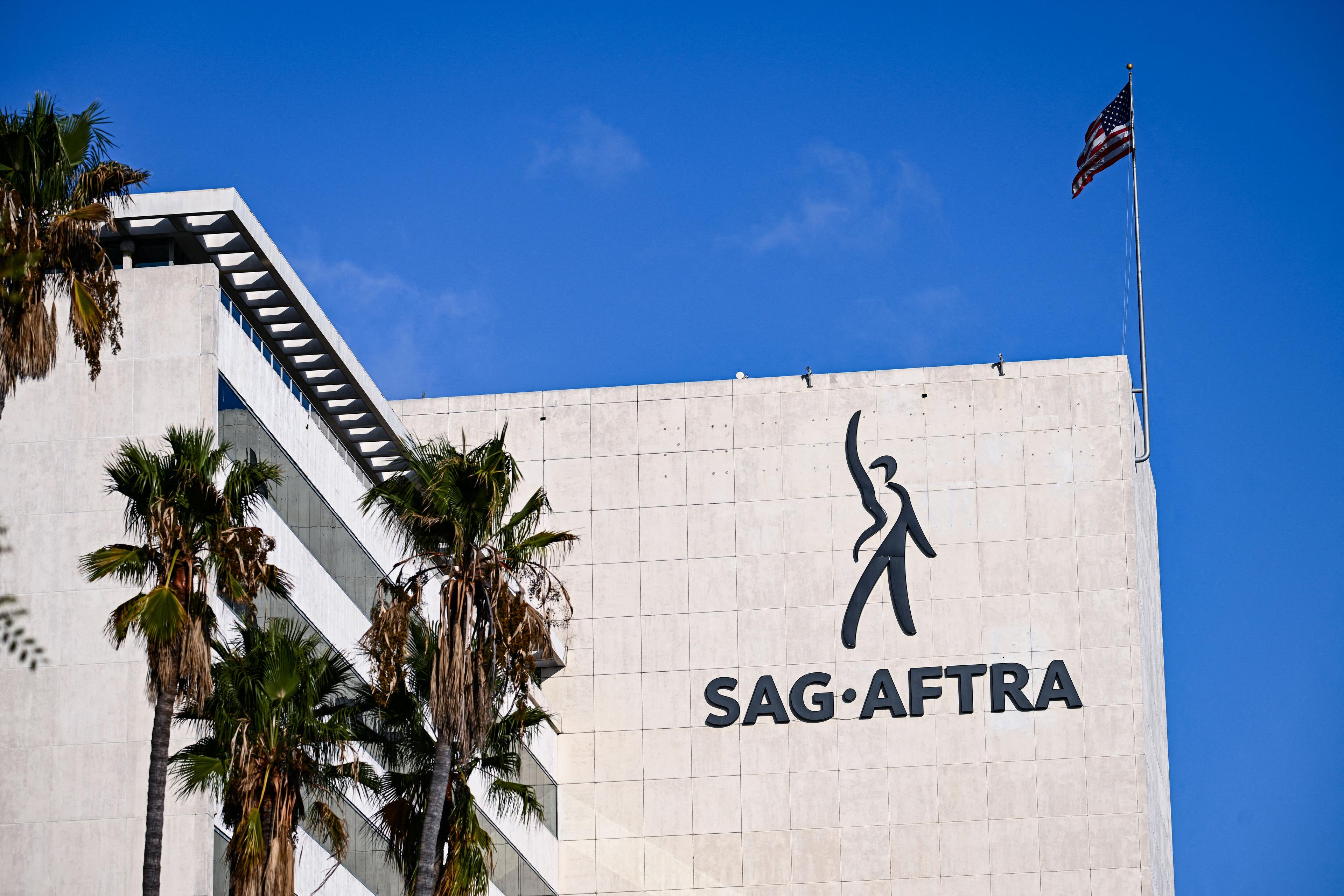 The SAG-AFTRA logo is displayed outside of its National Headquarters on Wilshire Boulevard during the actors strike in Los Angeles on Oct. 24, 2023. The union opposes the AI avatar "Tilly Norwood" after claims that the "access" was seeking talent representation. (Patrick T. Fallon/AFP via Getty Images)
