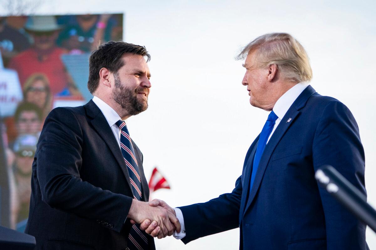 J.D. Vance, Republican candidate for U.S. Senate in Ohio, shakes hands with former President Donald Trump during a rally in Delaware, Ohio, on April 23, 2022. (Drew Angerer/Getty Images)