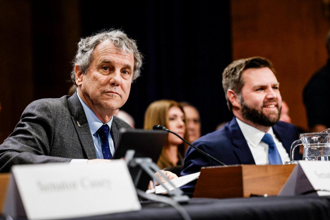 Sen. Sherrod Brown (D-Ohio) and Sen. J.D. Vance (R-Ohio) attend a panel with the Senate Environment and Public Works Committee at the U.S. Capitol Hill on March 9, 2023. The committee met to discuss concerns about public health and the environment in the wake of the Norfolk Southern train derailment and chemical release in East Palestine, Ohio. (Anna Moneymaker/Getty Images)