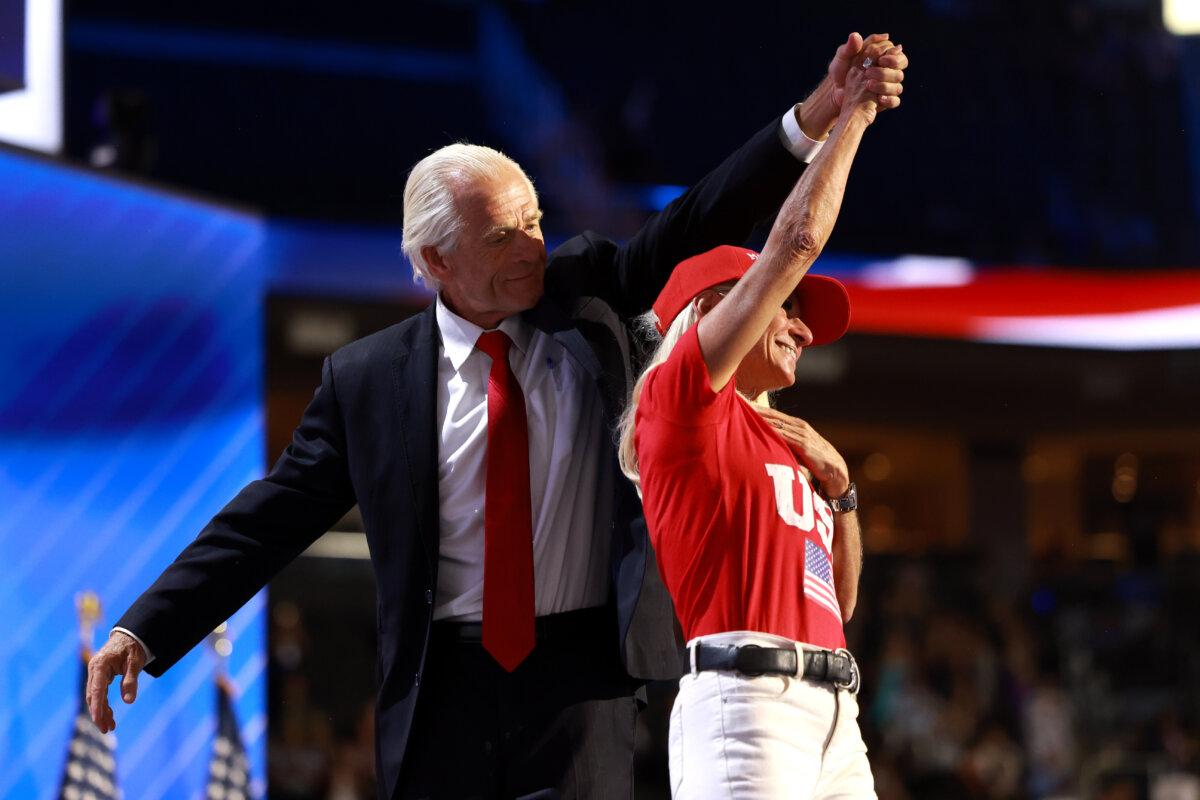 Peter Navarro walks off stage with his fiancee Bonnie on the third day of the Republican National Convention at the Fiserv Forum in Milwaukee, Wis., on July 17, 2024. (Joe Raedle/Getty Images)