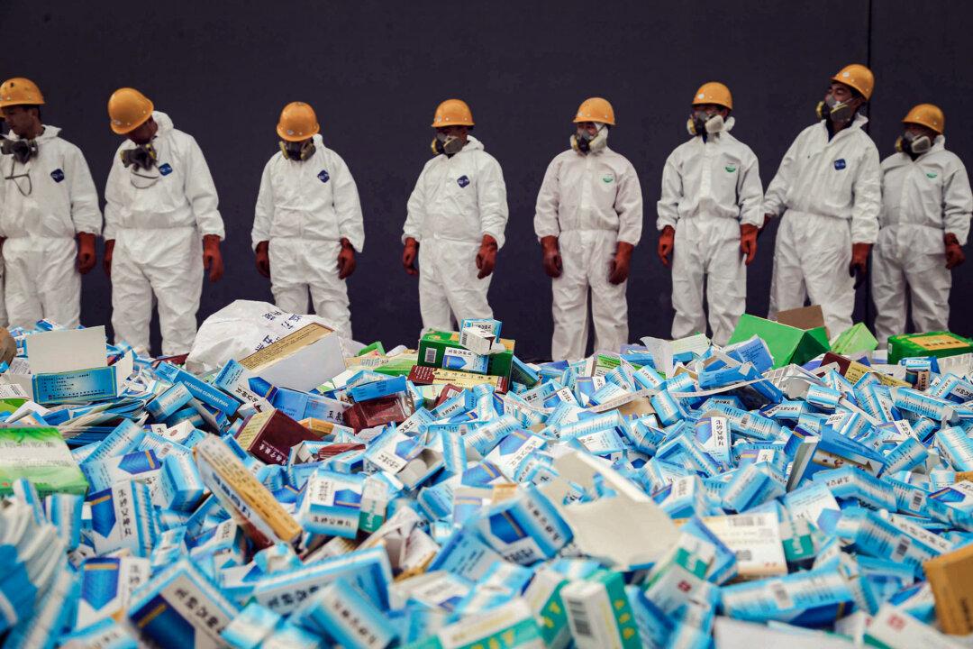 (Top) A soldier stands guard inside a clandestine chemical drug-processing laboratory discovered in Tlajomulco de Zuniga, on the outskirts of Guadalajara, Mexico, on Feb. 9, 2012. (Bottom) Health workers prepare to destroy packages of fake medicine seized in China, in this file photo. China protects fentanyl-producing companies inside its borders as long as the precursors are sold outside of China. (Hector Guerrero/AFP via Getty Images, STR/AFP via Getty Images)