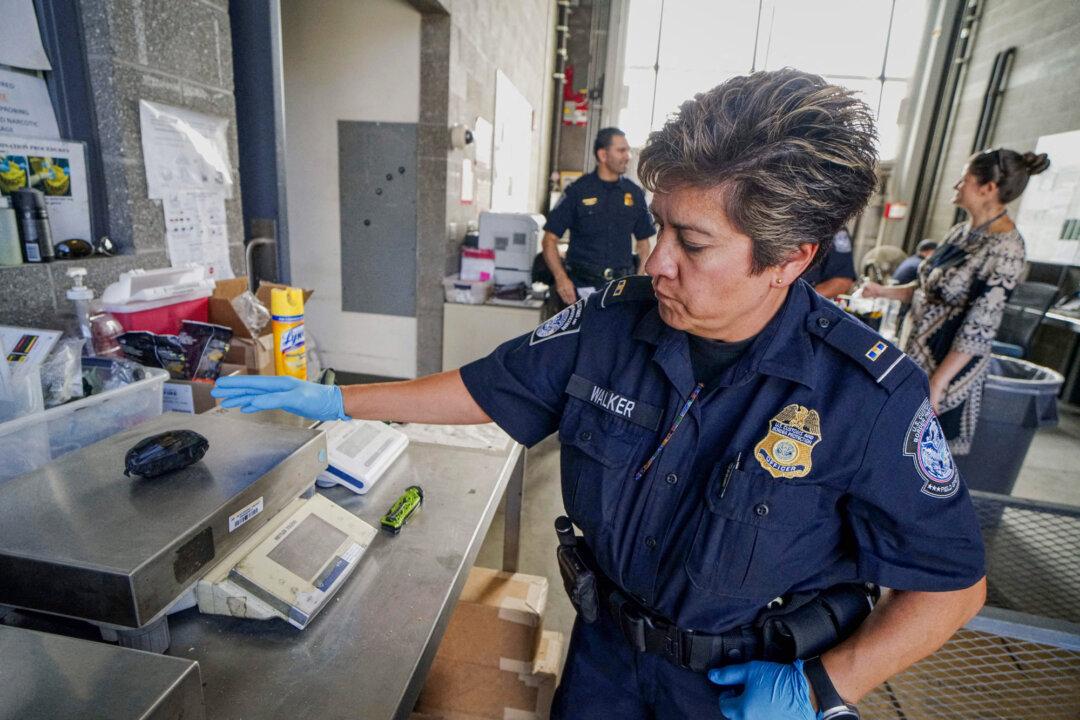 (Top) People stand in line to be checked by U.S. Customs and Border Protection agents at the San Ysidro Port of Entry in California, on Oct. 2, 2019. (Bottom Left) An officer from the U.S. Customs and Border Protection, Trade, and Cargo Division finds oxycodone pills in a parcel at John F. Kennedy International Airport’s U.S. Postal Service facility in New York on June 24, 2019. (Bottom Right) A U.S. Customs and Border Protection agent weighs a package of fentanyl at the San Ysidro Port of Entry in California, on Oct. 2, 2019. (Sandy Huffaker/AFP via Getty Images, Johannes Eisele/AFP via Getty Images).