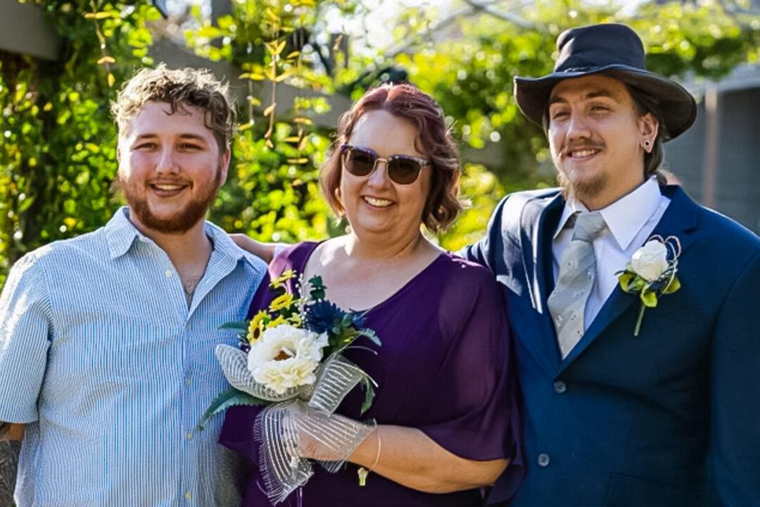 (L–R) James Stafford, his mother Marquita Berry, and brother Trinity Stafford, in an October 2022 photo. (Courtesy of Lillie Allmon, Monumental Photography)