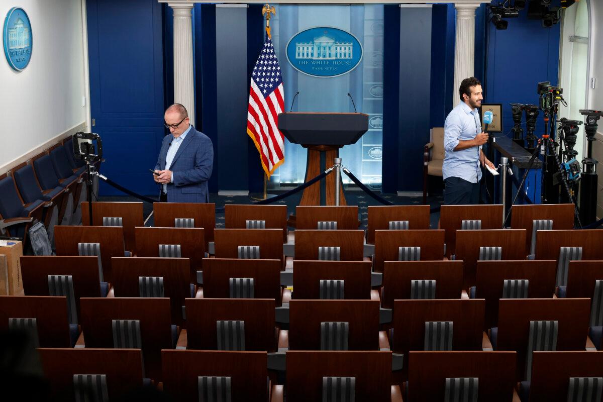 Correspondents use the White House Briefing Room to file reports of U.S. President Joe Biden's decision not to seek re-election on July 21, 2024. (Chip Somodevilla/Getty Images)