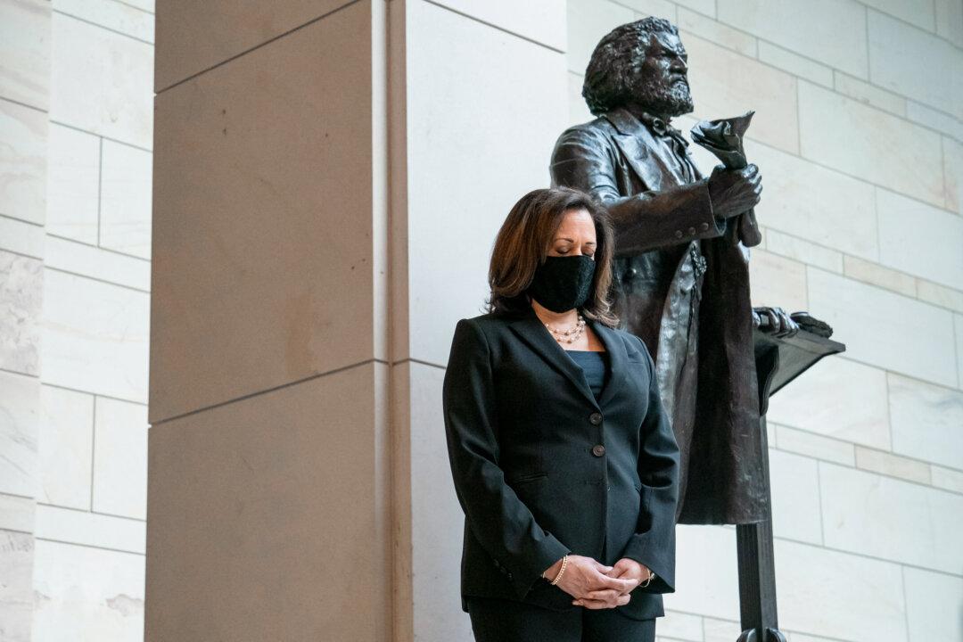 Senate Democrats, including Sen. Kamala Harris (D-Calif.), participate in a moment of silence for George Floyd and the Black Lives Matter movement in the Emancipation Hall of the U.S. Capitol on June 4, 2020. (Sarah Silbiger/Getty Images)