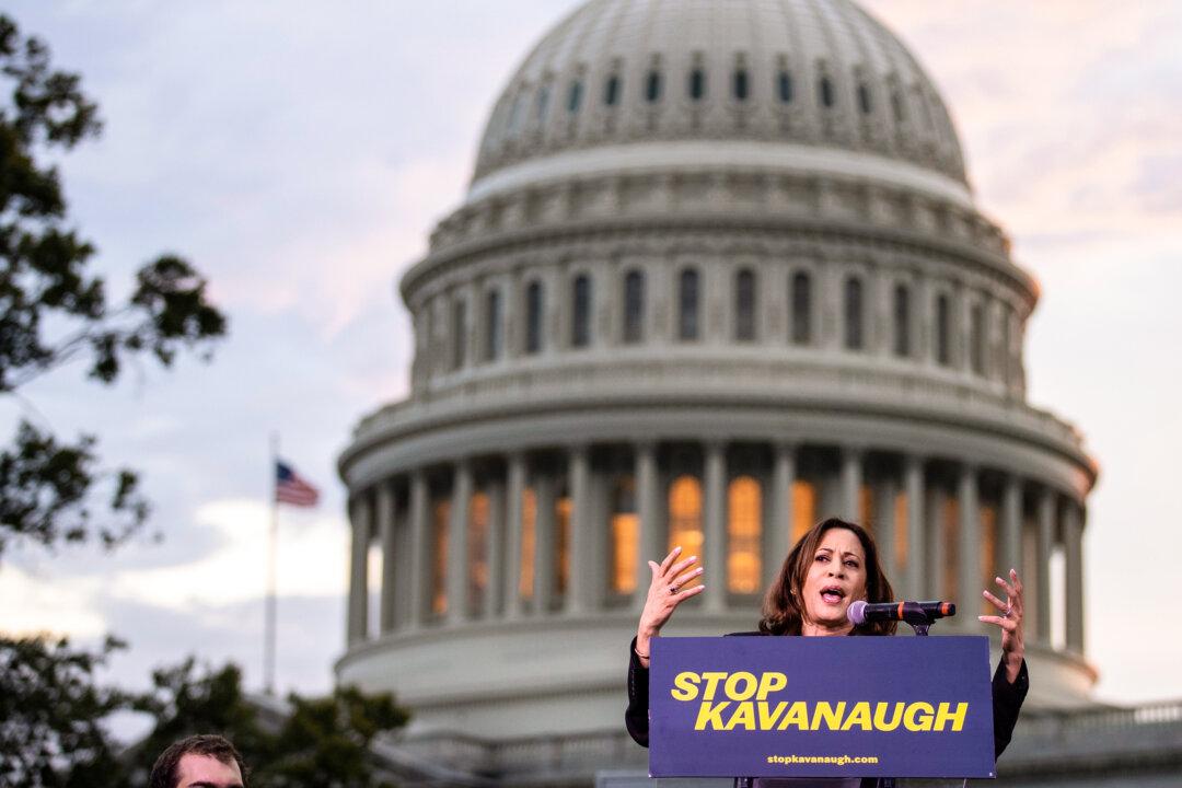 Sen. Kamala Harris (D-Calif.) speaks to protestors during the confirmation process of Supreme Court nominee Judge Brett Kavanaugh at the U.S. Capitol on Oct. 4, 2018. (Drew Angerer/Getty Images)